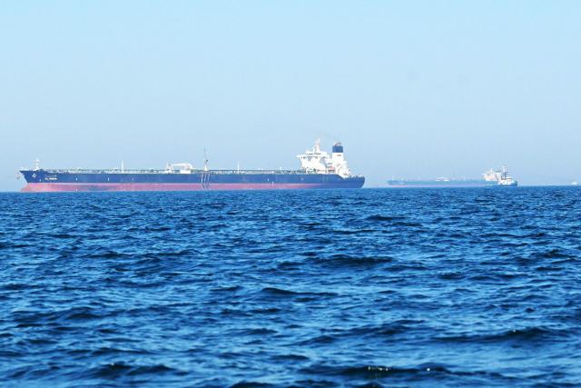 The 'Al-Riqqa' oil tanker (L) and 'Al-Yarmouk' oil tankers sail in the Arabian Gulf waters, off the coast of  Kuwait City on June 27, 2026. Kuwait came under attack from "hostile" missiles and drones, the country's army said on June 28, while in Bahrain air-raid sirens sounded following fresh US strikes against Iran. (Photo by YASSER AL-ZAYYAT / AFP) / 