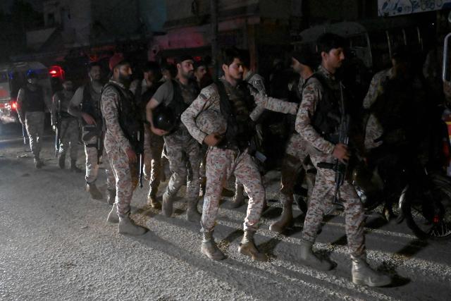 Paramilitary soldiers return after completing an operation following a militant attack on Pakistan's Security Rangers compound in Karachi on June 28, 2026. Heavy gunfire was heard in Pakistan's southern megacity Karachi on June 27 evening, according to AFP journalists, following reports of an explosion. (Photo by Rizwan TABASSUM / AFP)