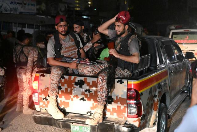 Paramilitary soldiers return after completing an operation following a militant attack on Pakistan's Security Rangers compound in Karachi on June 28, 2026. Heavy gunfire was heard in Pakistan's southern megacity Karachi on June 27 evening, according to AFP journalists, following reports of an explosion. (Photo by Rizwan TABASSUM / AFP)