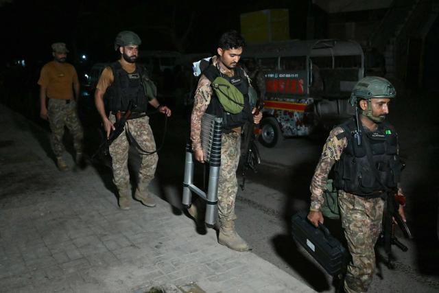 Paramilitary soldiers return after completing the operation after a militant attack on Pakistan's Security Rangers compound in Karachi on June 28, 2026. Heavy gunfire was heard in Pakistan's southern megacity Karachi on June 27 evening, according to AFP journalists, following reports of an explosion. (Photo by Rizwan TABASSUM / AFP)