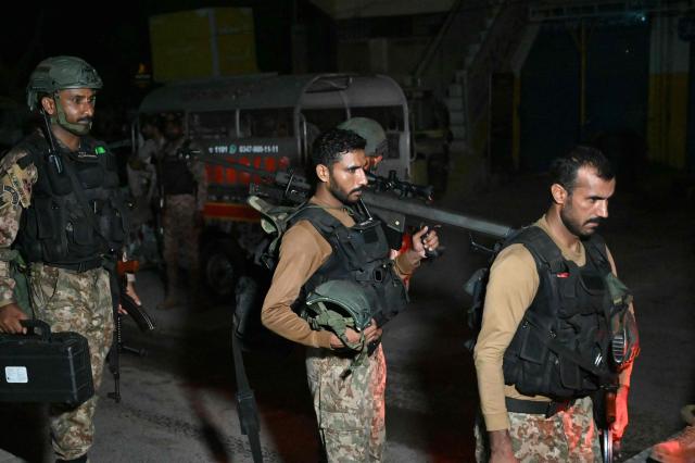 Paramilitary soldiers return after completing an operation following a militant attack on Pakistan's Security Rangers compound in Karachi on June 28, 2026. Heavy gunfire was heard in Pakistan's southern megacity Karachi on June 27 evening, according to AFP journalists, following reports of an explosion. (Photo by Rizwan TABASSUM / AFP)