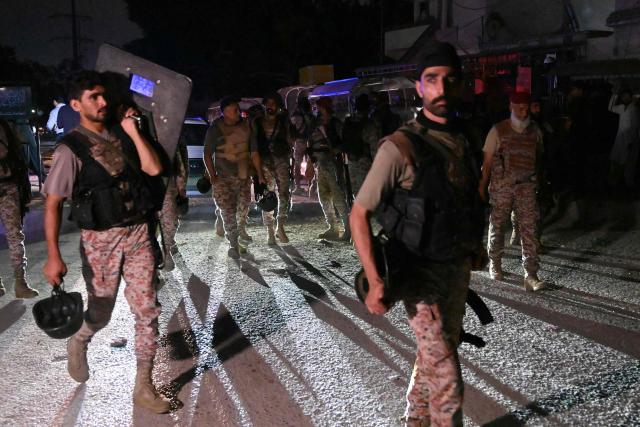 Paramilitary soldiers return after completing an operation following a militant attack on Pakistan's Security Rangers compound in Karachi on June 28, 2026. Heavy gunfire was heard in Pakistan's southern megacity Karachi on June 27 evening, according to AFP journalists, following reports of an explosion. (Photo by Rizwan TABASSUM / AFP)