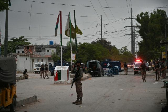 Paramilitary soldiers stand guard after security forces completed a clearance operation following a militant attack on Pakistan's Security Rangers compound in Karachi on June 28, 2026. Heavy gunfire was heard in Pakistan's southern megacity Karachi on June 27 evening, according to AFP journalists, following reports of an explosion. (Photo by Asif HASSAN / AFP)