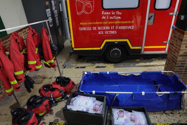 A photo shows an emergency cooling bath and packs of glass during a visit by France's Interior Minister at a fire station to review the crisis management response to the heat wave in Paris on June 28, 2026. (Photo by Kenzo TRIBOUILLARD / AFP)