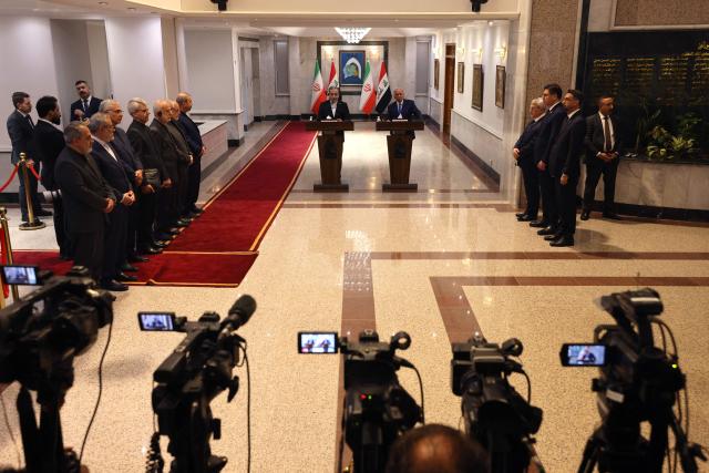 Iranian Foreign Minister Abbas Araqchi (top L) and Iraqi Foreign Minister Fuad hold a joint press conference following a meeting in Baghdad on July 28, 2026. Iran's foreign minister called on June 28, for the establishment of a security framework with Gulf countries, after Iranian strikes against US bases in the Gulf in retaliation for American attacks. (Photo by AHMAD AL-RUBAYE / AFP)