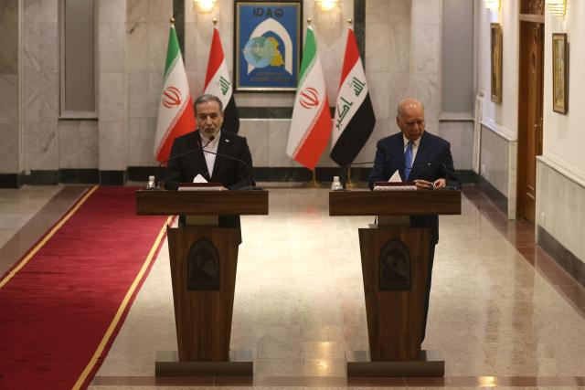 Iranian Foreign Minister Abbas Araqchi (L) and Iraqi Foreign Minister Fuad Hussein hold a joint press conference following a meeting in Baghdad on July 28, 2026. Iran's foreign minister called on June 28, for the establishment of a security framework with Gulf countries, after Iranian strikes against US bases in the Gulf in retaliation for American attacks. (Photo by AHMAD AL-RUBAYE / AFP)