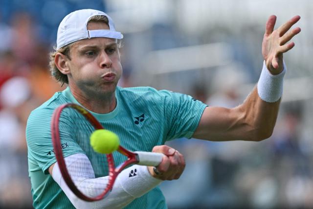 Belgium's Zizou Bergs hits a return against France's Ugo Humbert during their men's final tennis match on day seven of the Lexus Eastbourne Open at Devonshire Park, Eastbourne, on the south coast of England on June 28, 2026. (Photo by Glyn KIRK / AFP)