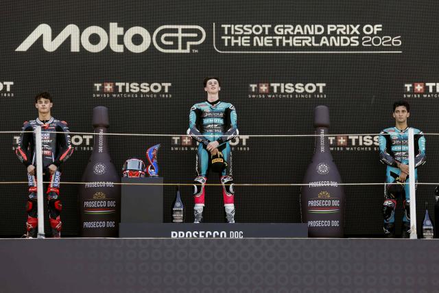 Winner, KTM's Spanish rider Maximo Quiles (C), next to seond-placed KTM's Spanish rider David Almansa (L) and third-placed CFMOTO Gaviota Aspar Team's Argentina's rider Marco Morelli (R), celebrates his victory on the podium in the Moto3 race during the 95th edition of the Dutch Motorcycle Grand Prix at the TT Circuit Assen, in Assen, on June 28, 2026. (Photo by Vincent Jannink / ANP / AFP) / Netherlands OUT