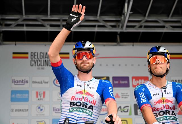 Red Bull Bora Hansgrohe's Belgian rider Jordi Meeus waves before the start of the Belgian Cycling Championships men's elite race (240km) from the Grote Markt square in Antwerp to Brasschaat on June 28, 2026. (Photo by MAARTEN STRAETEMANS / Belga / AFP) / Belgium OUT