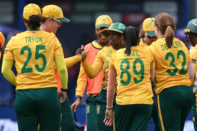 South Africa's Nonkululeko Mlaba (C) is congratulated after taking a catch to dismiss Bangladesh's Sobhana Mostary during the ICC Women's T20 cricket world cup 2026 game between South Africa and Bangladesh, at Lord's in London on June 28, 2026. (Photo by JUSTIN TALLIS / AFP)