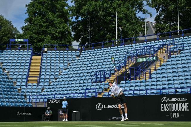 France's Ugo Humbert serves against Belgium's Zizou Bergs during their men's final tennis match on day seven of the Lexus Eastbourne Open at Devonshire Park, Eastbourne, on the south coast of England on June 28, 2026. (Photo by Glyn KIRK / AFP)