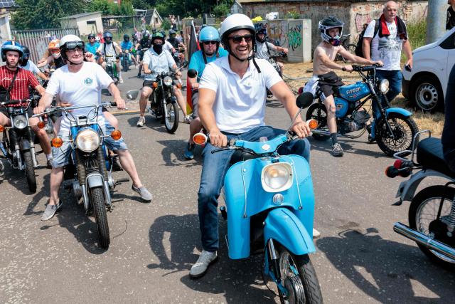 The far-right Alternative for Germany (AfD) party's top candidate for the regional elections in Saxony-Anhalt, Ulrich Siegmund and supporters take part in an election campaign event and a motorbike and moped ride in Jessnitz, eastern Germany on June 28, 2026. On September 6, 2026, The eastern German state of Saxony-Anhalt will elect a new state parliament. (Photo by Jens SCHLÜTER / AFP)