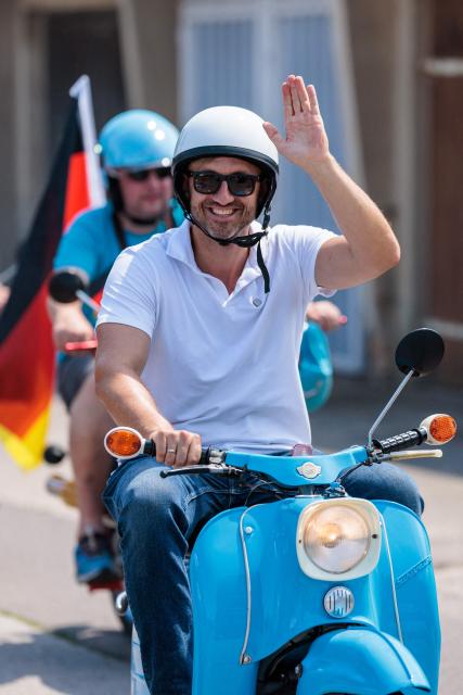 The far-right Alternative for Germany (AfD) party's top candidate for the regional elections in Saxony-Anhalt, Ulrich Siegmund drives a moped as he takes part in an election campaign event and a motorbike and moped ride in Jessnitz, eastern Germany on June 28, 2026. On September 6, 2026, The eastern German state of Saxony-Anhalt will elect a new state parliament. (Photo by Jens SCHLÜTER / AFP)