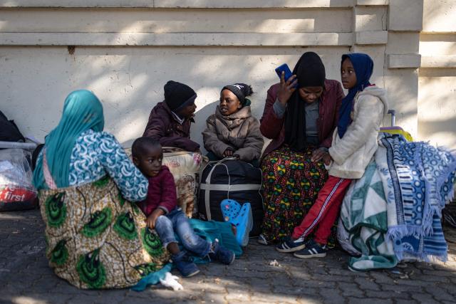 Malawian nationals gather in front of the Malawi Consulate General in Johannesburg on June 28, 2026. South Africans President Cyril Ramaphosa vowed on Thursday to crush any attempts to destabilise the nation during planned anti-immigrant marches next week, amid a wave of xenophobia. Citizen-led groups have set Tuesday 30 as a deadline for undocumented foreigners to leave and called for nationwide marches against illegal immigration, marking a crescendo in months of protests that have at times turned violent. (Photo by EMMANUEL CROSET / AFP)