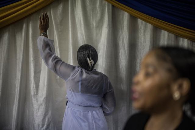 TOPSHOT - Worshippers join a crowd of both South African and foreign congregants as they gather to pray at the Supernatural Platform Global Ministries church of pastors Professor Vivian Besem Ojong and John Arinze, both of Nigerian origin, in Durban, on June 28, 2026. South Africans President Cyril Ramaphosa vowed on Thursday to crush any attempts to destabilise the nation during planned anti-immigrant marches next week, amid a wave of xenophobia. Citizen-led groups have set Tuesday 30 as a deadline for undocumented foreigners to leave and called for nationwide marches against illegal immigration, marking a crescendo in months of protests that have at times turned violent. (Photo by MARCO LONGARI / AFP)