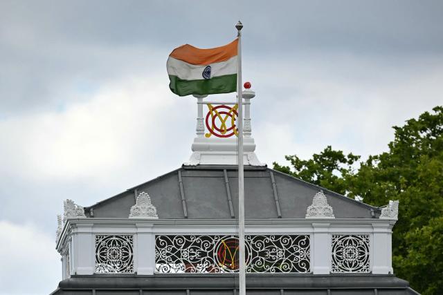 India's flag flies on the pavilion beside the MCC (Marylebone Cricket Club) logo, during the ICC Women's T20 cricket world cup 2026 game between Australia and India, at Lord's in London on June 28, 2026. (Photo by JUSTIN TALLIS / AFP)