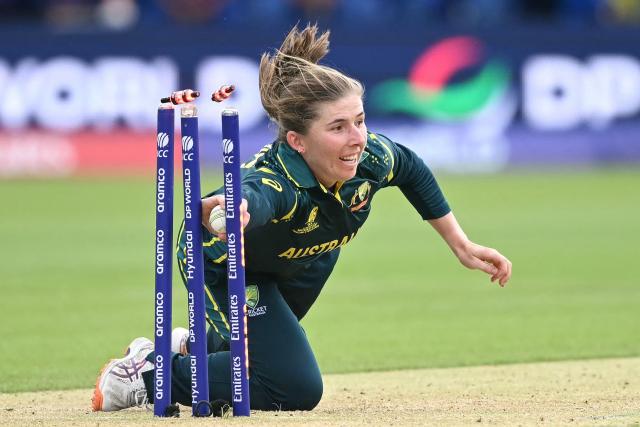 Australia's Georgia Wareham runs out India's Smriti Mandhana during the ICC Women's T20 cricket world cup 2026 game between Australia and India, at Lord's in London on June 28, 2026. (Photo by JUSTIN TALLIS / AFP)