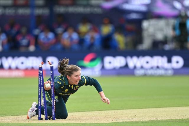 Australia's Georgia Wareham runs out India's Smriti Mandhana during the ICC Women's T20 cricket world cup 2026 game between Australia and India, at Lord's in London on June 28, 2026. (Photo by JUSTIN TALLIS / AFP)