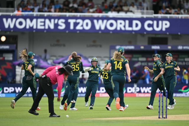 Australia's players celebrate the run-out of India's Smriti Mandhana during the ICC Women's T20 cricket world cup 2026 game between Australia and India, at Lord's in London on June 28, 2026. (Photo by JUSTIN TALLIS / AFP)
