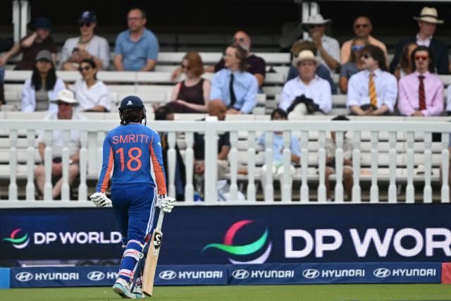 India's Smriti Mandhana walks back to the pavilion having lost her wicket for 38 during the ICC Women's T20 cricket world cup 2026 game between Australia and India, at Lord's in London on June 28, 2026. (Photo by JUSTIN TALLIS / AFP)