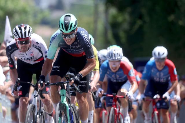 Decathlon CMA CGM team's French rider Jordan Labrosse (C) competes in the men's Elite Road Race, part of the French Cycling Championship 2026, near La Tour du Pin, central-eastern France on June 28, 2026. (Photo by Alex MARTIN / AFP)