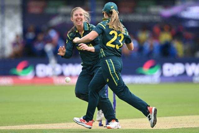 Australia's Georgia Wareham (L) celebrates with Australia's captain Sophie Molineux (R) after running out India's Smriti Mandhana during the ICC Women's T20 cricket world cup 2026 game between Australia and India, at Lord's in London on June 28, 2026. (Photo by JUSTIN TALLIS / AFP)