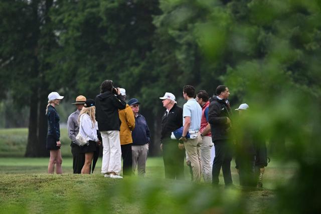 US President Donald Trump speaks with golf course architect Tom Fazio (center L) as he visits East Potomac Golf Links in Washington, DC, on June 28, 2026. (Photo by Kent NISHIMURA / AFP)