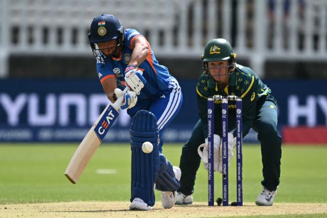 India's captain Harmanpreet Kaur plays s shot as Australia's Beth Mooney keeps wicket during the ICC Women's T20 cricket world cup 2026 game between Australia and India, at Lord's in London on June 28, 2026. (Photo by JUSTIN TALLIS / AFP)