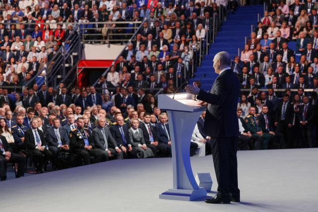 In this pool photograph distributed by Russian state agency Sputnik, Russia's Vladimir Putin addresses the audience at the 23rd Congress of the United Russia party in Moscow on June 28, 2026. Vladimir Putin vowed on June 28, 2026 to ensure security and overcome challenges as Ukraine stepped up its retaliatory strikes inside Russia amid Moscow's four-year war. (Photo by Gavriil Grigorov / POOL / AFP)
