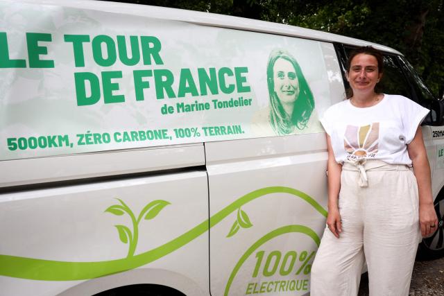 National secretary of French left-wing The Ecologistes party Marine Tondelier poses in front of the electric van she uses for her tour of France during a stop in Issigeac, southwestern France on June 28, 2026. (Photo by ROMAIN PERROCHEAU / AFP)