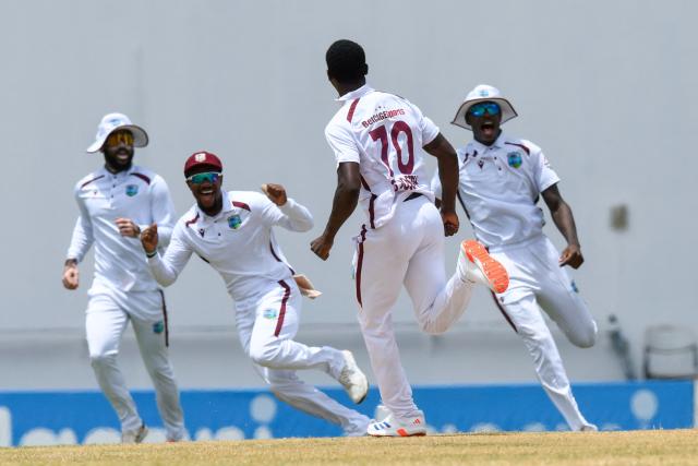 Shamar Joseph (2R) of West Indies celebrates the dismissal of Dhananjaya de Silva of Sri Lanka during the fourth day of the 1st cricket Test match between West Indies and Sri Lanka at Sir Vivian Richards Stadium in North Sound, Antigua and Barbuda, on June 28, 2026. (Photo by Randy Brooks / AFP)
