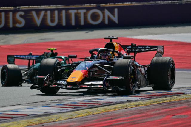 Red Bull Racing's Dutch driver Max Verstappen (R) competes ahead of Aston Martin's Spanish driver Fernando Alonso during the Formula One Austrian Grand Prix at the Red Bull Ring race track in Spielberg, Austria on June 28, 2026. (Photo by Andrej ISAKOVIC / AFP)