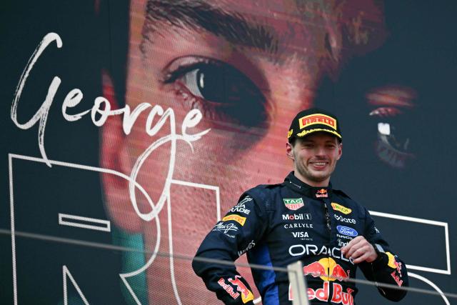Second placed Red Bull Racing's Dutch driver Max Verstappen stands in front of a display showing winner Mercedes' British driver George Russell on the podium after the Formula One Austrian Grand Prix at the Red Bull Ring race track in Spielberg, Austria on June 28, 2026. (Photo by Andrej ISAKOVIC / AFP)