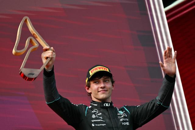 Third placed Mercedes' Italian driver Kimi Antonelli celebrates with the trophy on the podium after the Formula One Austrian Grand Prix at the Red Bull Ring race track in Spielberg, Austria on June 28, 2026. (Photo by Andrej ISAKOVIC / AFP)