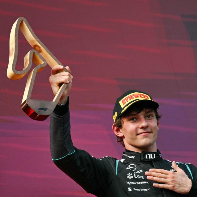 Third placed Mercedes' Italian driver Kimi Antonelli celebrates with the trophy on the podium after the Formula One Austrian Grand Prix at the Red Bull Ring race track in Spielberg, Austria on June 28, 2026. (Photo by Andrej ISAKOVIC / AFP)