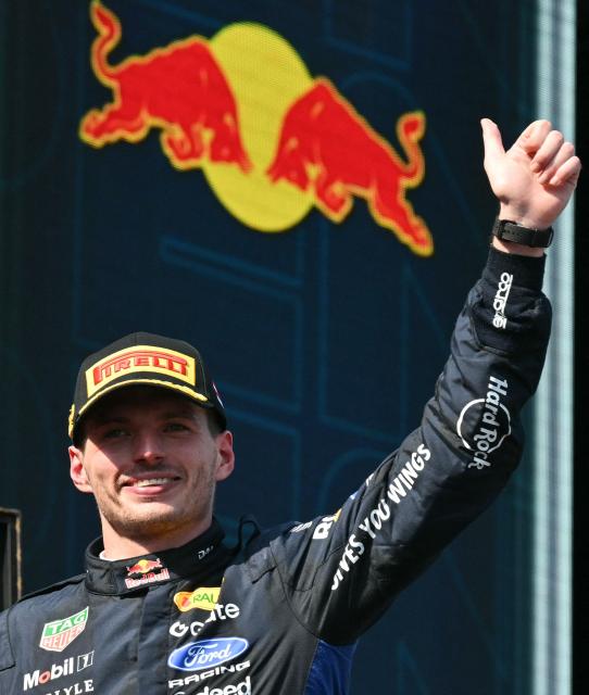 Second placed Red Bull Racing's Dutch driver Max Verstappen arrives on the podium while the Red Bull logo is seen in the background after the Formula One Austrian Grand Prix at the Red Bull Ring race track in Spielberg, Austria on June 28, 2026. (Photo by Andrej ISAKOVIC / AFP)