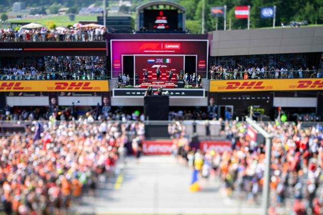(L-R) Second placed Red Bull Racing's Dutch driver Max Verstappen, winner Mercedes' British driver George Russell and third placed Mercedes' Italian driver Kimi Antonelli celebrate on the podium after the Formula One Austrian Grand Prix at the Red Bull Ring race track in Spielberg, Austria on June 28, 2026. (Photo by MAX SLOVENCIK / APA / AFP) / Austria OUT