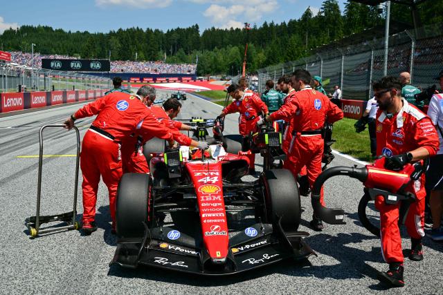 Mechanics work on the car of Ferrari's British driver Lewis Hamilton prior to the Formula One Austrian Grand Prix at the Red Bull Ring race track in Spielberg, Austria on June 28, 2026. (Photo by Andrej ISAKOVIC / AFP)