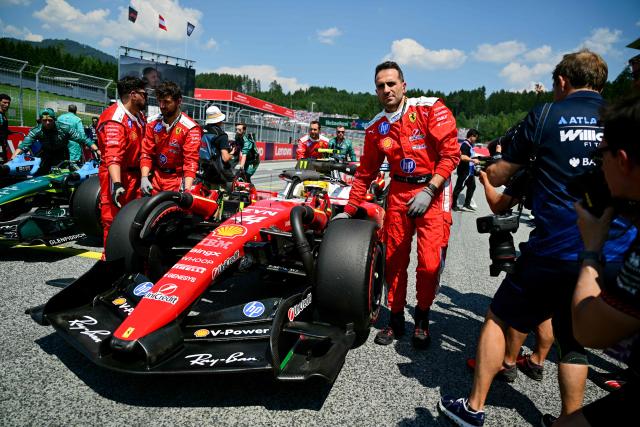 Mechanics move the car with Ferrari's British driver Lewis Hamilton prior to the Formula One Austrian Grand Prix at the Red Bull Ring race track in Spielberg, Austria on June 28, 2026. (Photo by Andrej ISAKOVIC / AFP)