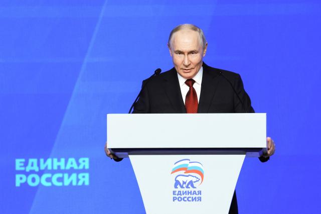 In this pool photograph distributed by Russian state agency Sputnik, Russia's Vladimir Putin addresses the audience at the 23rd Congress of the United Russia party in Moscow on June 28, 2026. Vladimir Putin vowed on June 28, 2026 to ensure security and overcome challenges as Ukraine stepped up its retaliatory strikes inside Russia amid Moscow's four-year war. (Photo by Yekaterina SHTUKINA / POOL / AFP)