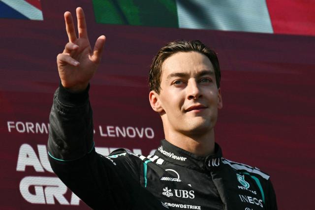 Winner Mercedes' British driver George Russell celebrates on the podium after the Formula One Austrian Grand Prix at the Red Bull Ring race track in Spielberg, Austria on June 28, 2026. (Photo by Andrej ISAKOVIC / AFP)