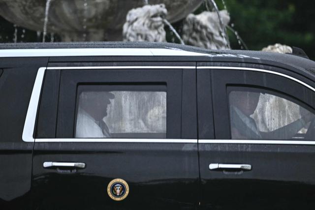 US President Donald Trump rides in his motorcade as he departs Trump National Golf Club in Sterling, Virginia, on June 28, 2026. (Photo by Kent NISHIMURA / AFP)