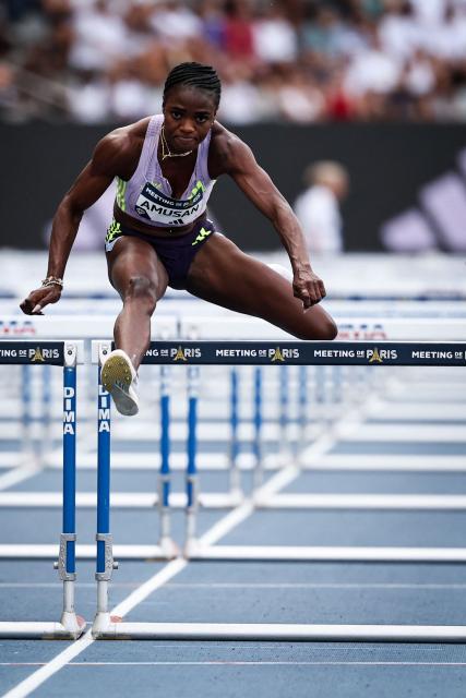 First-placed Nigeria's Tobi Amusan competes in the women's 100m Hurdles final during the IAAF Diamond League athletics meeting, at the Charlety Stadium, in Paris on June 28, 2026. (Photo by Anne-Christine POUJOULAT / AFP)