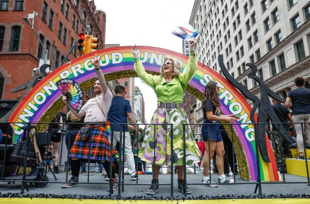Members of SAG-AFTRA ride on a float under a rainbow reading “Union Proud, Union Strong” during the annual New York City Pride March in New York on June 28, 2026. (Photo by kena betancur / AFP)