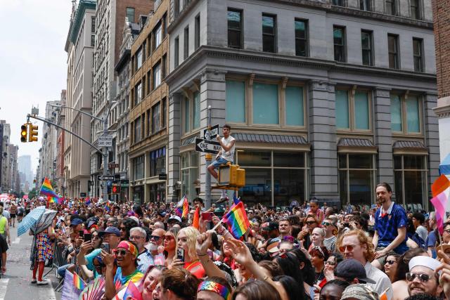 People watch the annual New York City Pride March in New York on June 28, 2026. (Photo by kena betancur / AFP)