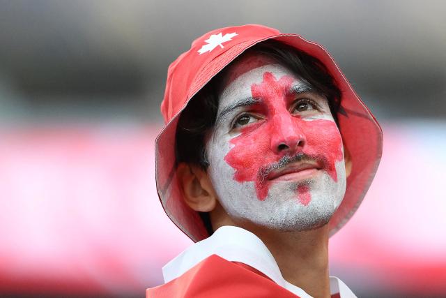 A Canadian fan with his face painted gestures ahead of the 2026 World Cup round of 32 football match between South Africa and Canada at the Los Angeles Stadium in Inglewood on June 28, 2026.  (Photo by Patrick T. Fallon / AFP)