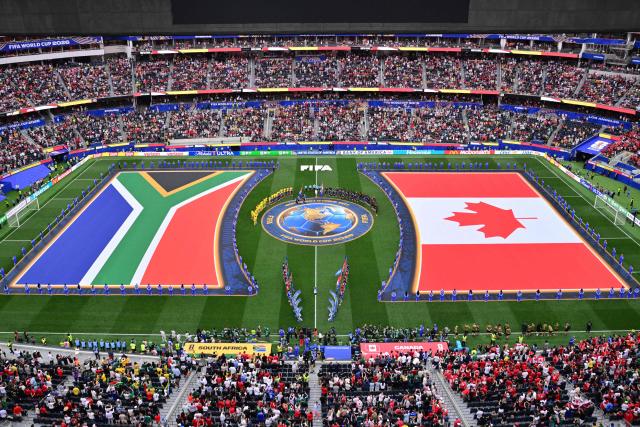 South Africa and Canada players stand for the national anthems ahead of the 2026 World Cup round of 32 football match between South Africa and Canada at the Los Angeles Stadium in Inglewood on June 28, 2026.  (Photo by Frederic J. Brown / AFP)