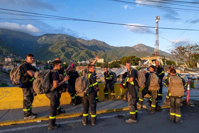 Members of the French Civil Security Training and Intervention Regiment (UIISC 7) attend an area affected by building collapses in La Guaira state, Venezuela, on June 28, 2026, following earthquakes. Thousands of rescuers, relatives and volunteers dig day and night through mounds of concrete to find survivors of the earthquakes that struck Venezuela more than three days ago, leaving nearly 1,500 dead and tens of thousands missing. (Photo by Miguel MEDINA / POOL / AFP)
