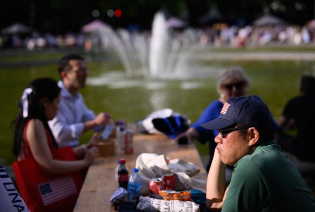 People attend celebrations for the 250 years of The United States' independence in the Cinquantenaire Park in Brussels on June 28, 2026. (Photo by JOHN THYS / AFP)
