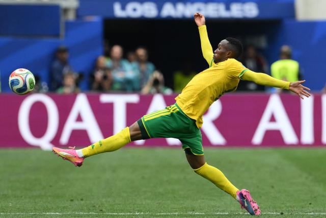 South Africa's forward #12 Thapelo Maseko kicks the ball during the 2026 World Cup round of 32 football match between South Africa and Canada at the Los Angeles Stadium in Inglewood on June 28, 2026.  (Photo by Patrick T. Fallon / AFP)